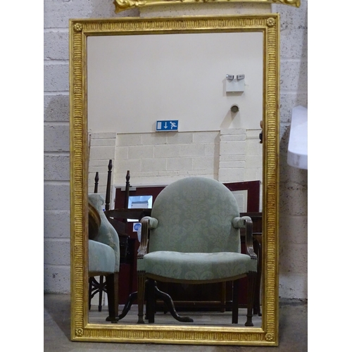 105 - A gilt wood wall mirror with carved foliate frame enclosing the later mirror plate, 75 x 62cm, (old ... 
