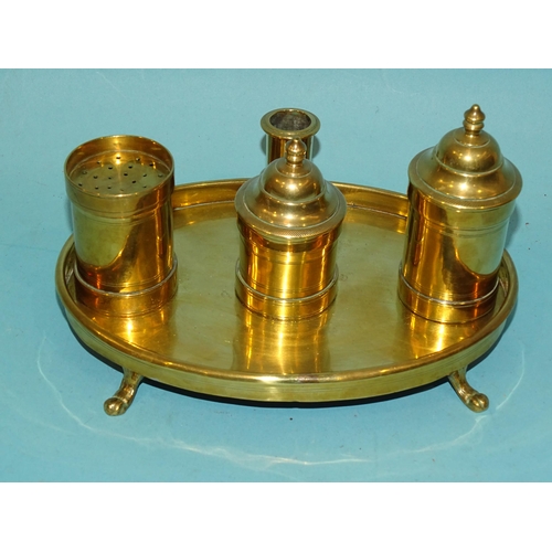 114 - An unusual 18th century brass standish or desk set, the oval tray with removable pounce pot, fixed i... 
