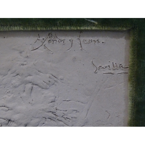 117 - A plaster relief plaque titled A Penar. Leon Sevilla?, with two figures on horseback, within a glaze... 