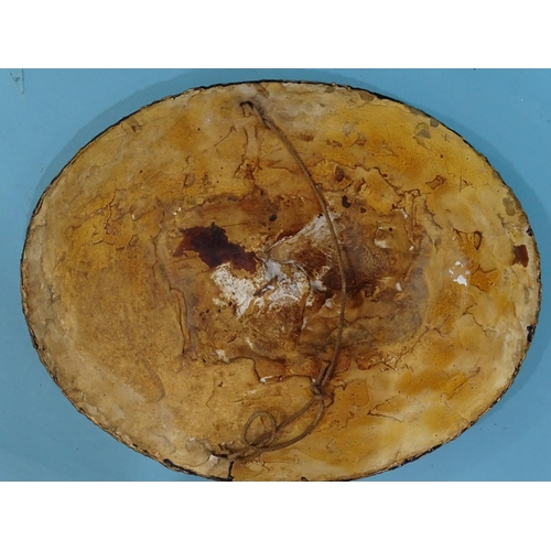 117 - A plaster relief plaque titled A Penar. Leon Sevilla?, with two figures on horseback, within a glaze... 