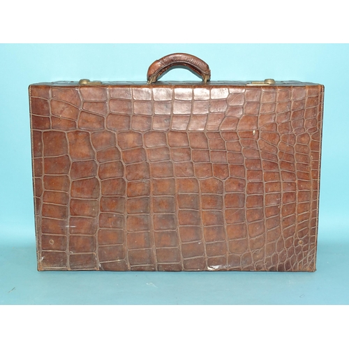 118 - A crocodile skin suitcase by The North West Tannery Co. Ltd, Cawnpore, 56 x 37cm and a smaller suitc... 