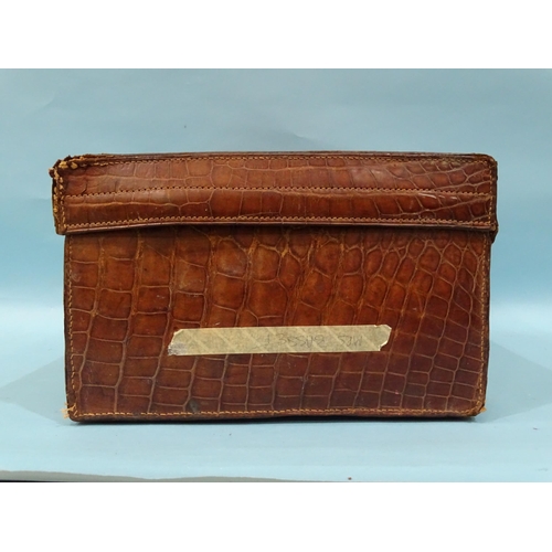 118 - A crocodile skin suitcase by The North West Tannery Co. Ltd, Cawnpore, 56 x 37cm and a smaller suitc... 