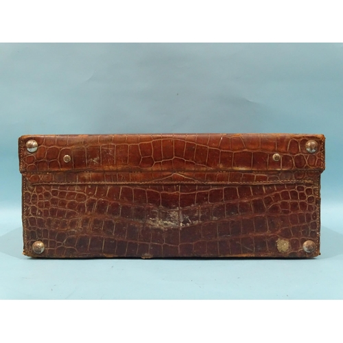 118 - A crocodile skin suitcase by The North West Tannery Co. Ltd, Cawnpore, 56 x 37cm and a smaller suitc... 