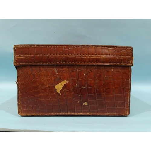 118 - A crocodile skin suitcase by The North West Tannery Co. Ltd, Cawnpore, 56 x 37cm and a smaller suitc... 