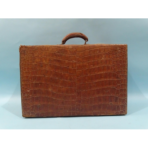 118 - A crocodile skin suitcase by The North West Tannery Co. Ltd, Cawnpore, 56 x 37cm and a smaller suitc... 