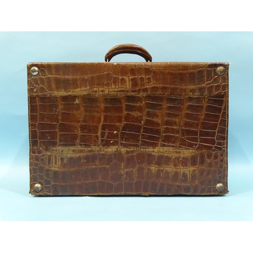 118 - A crocodile skin suitcase by The North West Tannery Co. Ltd, Cawnpore, 56 x 37cm and a smaller suitc... 
