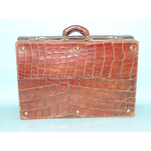 118 - A crocodile skin suitcase by The North West Tannery Co. Ltd, Cawnpore, 56 x 37cm and a smaller suitc... 