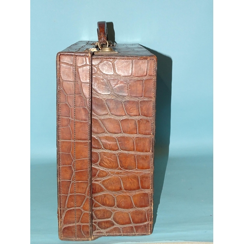 118 - A crocodile skin suitcase by The North West Tannery Co. Ltd, Cawnpore, 56 x 37cm and a smaller suitc... 