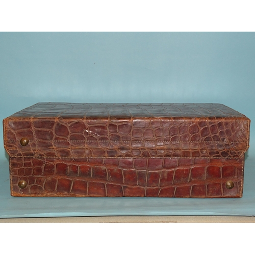 118 - A crocodile skin suitcase by The North West Tannery Co. Ltd, Cawnpore, 56 x 37cm and a smaller suitc... 
