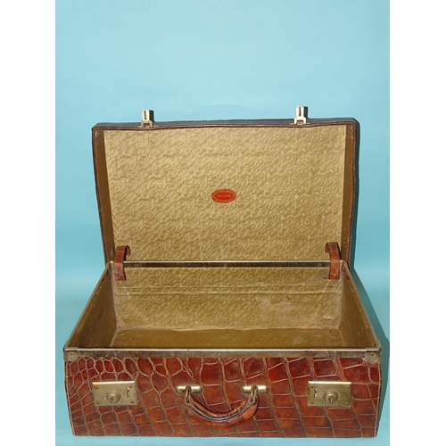 118 - A crocodile skin suitcase by The North West Tannery Co. Ltd, Cawnpore, 56 x 37cm and a smaller suitc... 