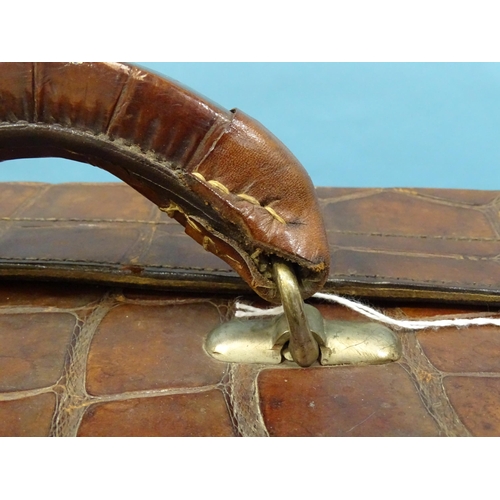 118 - A crocodile skin suitcase by The North West Tannery Co. Ltd, Cawnpore, 56 x 37cm and a smaller suitc... 