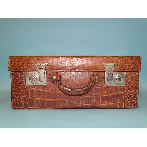 118 - A crocodile skin suitcase by The North West Tannery Co. Ltd, Cawnpore, 56 x 37cm and a smaller suitc... 