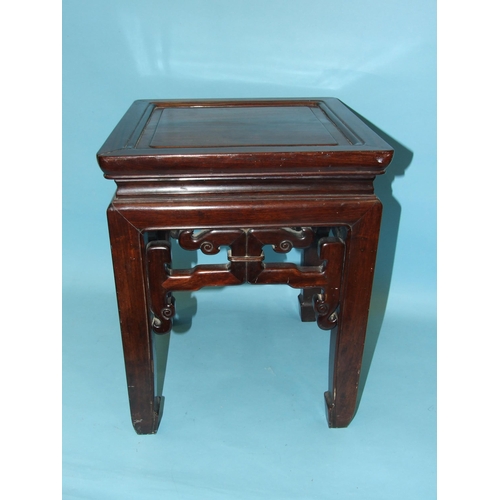 13 - A Chinese hardwood square-topped urn stand with pierced frieze decoration, on square shaped legs, 36... 
