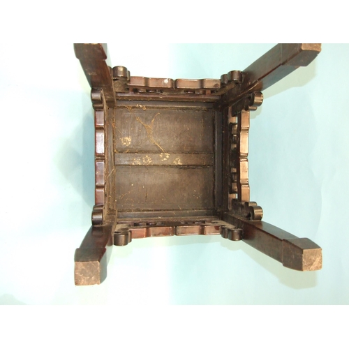 13 - A Chinese hardwood square-topped urn stand with pierced frieze decoration, on square shaped legs, 36... 