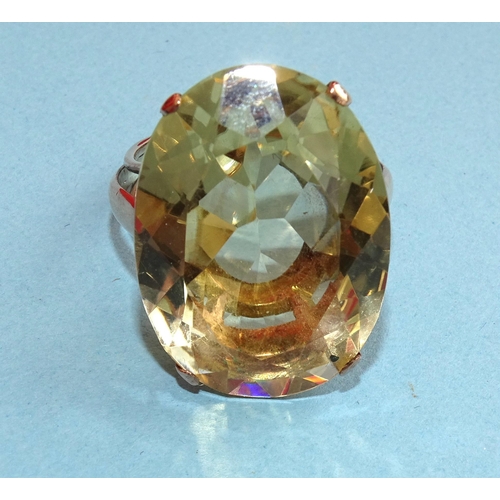 237 - A gold dress ring set very large oval citrine, (approximately 22cts), unmarked, tested as 9ct gold, ... 