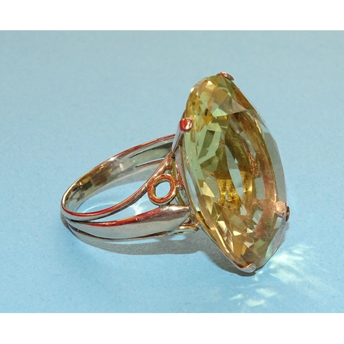 237 - A gold dress ring set very large oval citrine, (approximately 22cts), unmarked, tested as 9ct gold, ... 