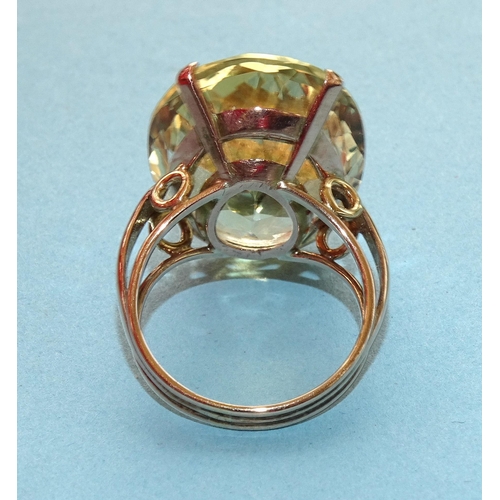 237 - A gold dress ring set very large oval citrine, (approximately 22cts), unmarked, tested as 9ct gold, ... 