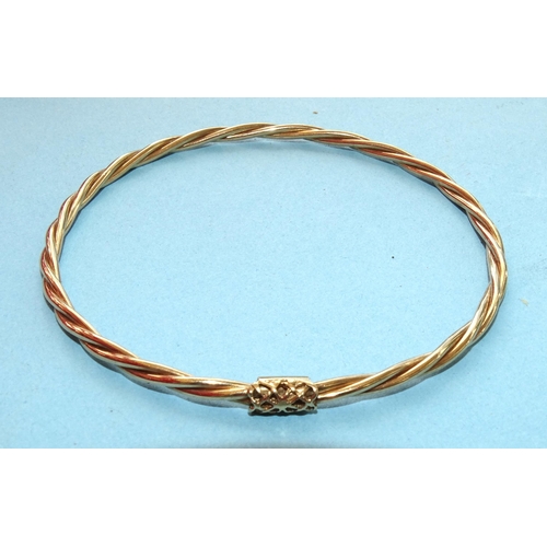249 - A 9ct gold bangle of twist design, 64mm diameter, 5.3g.