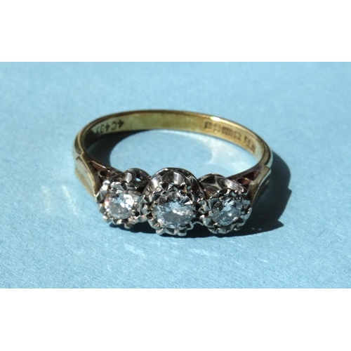251 - A three-stone diamond ring, the brilliant-cut diamonds illusion-set in 18ct gold mount, size N&frac1... 