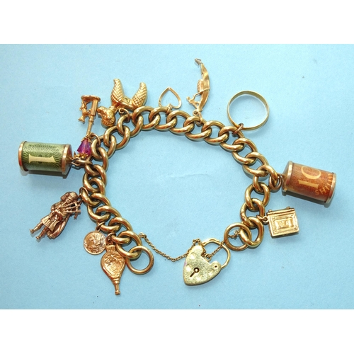 253 - A 9ct gold curb-link bracelet with ten charms, one 22ct gold wedding band and padlock clasp, gross w... 