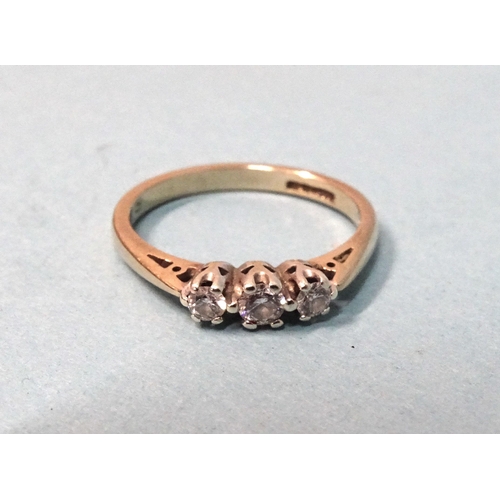 259 - A three stone diamond ring, the brilliant cut diamonds claw set in 9ct gold mount, size N, 2g.... 