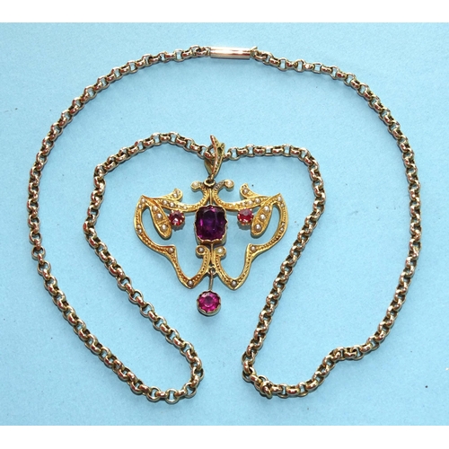 281 - An Edwardian-style unmarked gold pendant set seed pearls and red stones, (central stone chipped and ... 