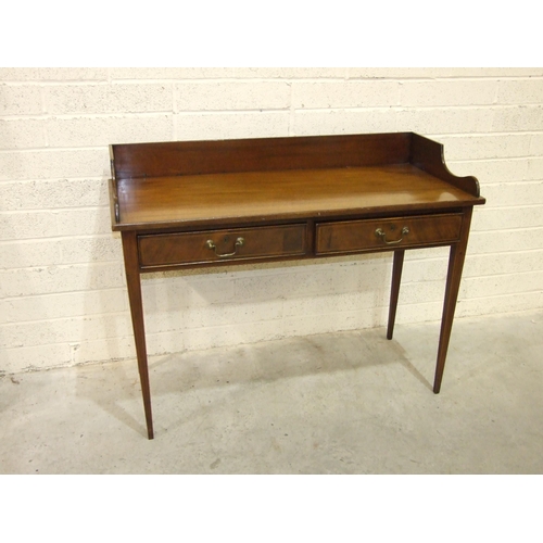 4 - A mahogany inlaid wash stand, the solid gallery above two drawers, on square tapered legs, 121cm wid... 