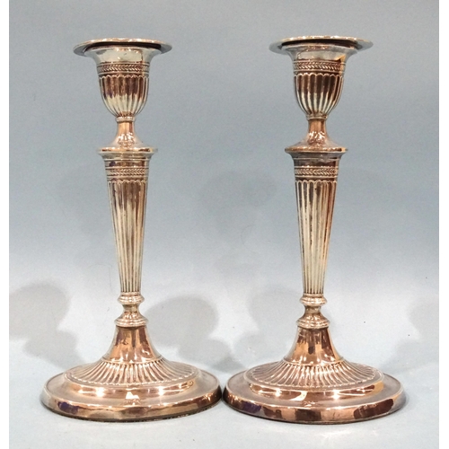 479 - A pair of silver Adam-style candlesticks of tapered form, on oval bases, Fordham & Fordham, Shef... 