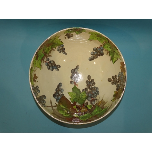 83 - A large Royal Doulton punch bowl transfer-printed and painted with vines and grapes, green printed m... 