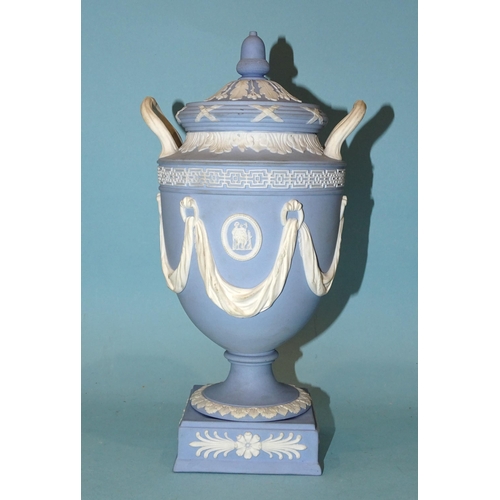 84 - A Wedgwood Etruria jasperware urn-shaped vase and cover decorated in the classical style with draper... 