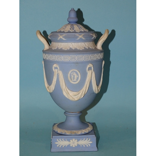 84 - A Wedgwood Etruria jasperware urn-shaped vase and cover decorated in the classical style with draper... 