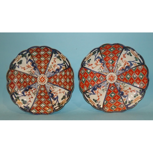 91 - A pair of Oriental Imari-pattern chargers, 32cm diameter, (2).