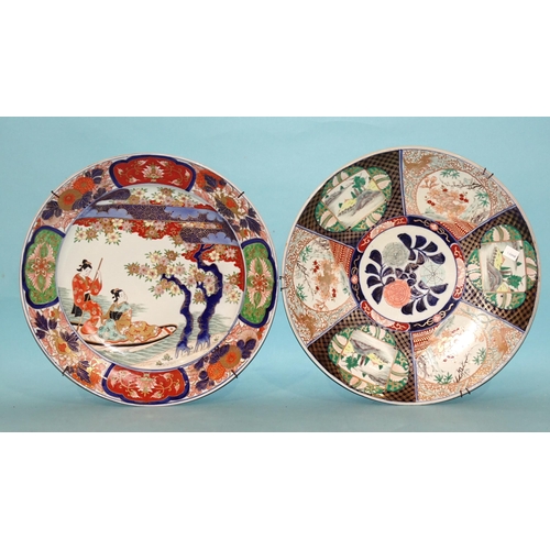 93 - A large Japanese wall charger decorated with figures in a boat, in Imari colours, 46cm diameter and ... 