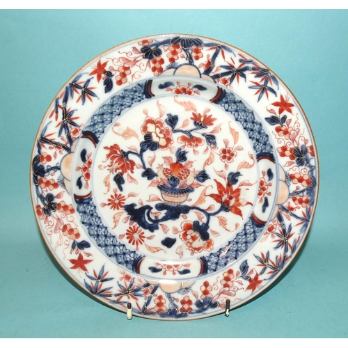 94 - A pair of 19th century Chinese plates decorated with flowers in Imari colours, 22.5cm diameter, (2).... 