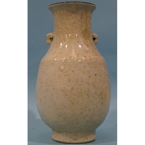 95 - An early-20th century Chinese moulded and crackle-glazed baluster vase, the white ground decorated w... 