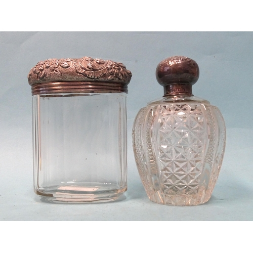 471 - A silver-topped cut-glass scent bottle with stopper, Birmingham 1908, 10cm high and a silver-topped ... 