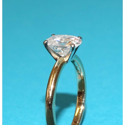 247 - WITHDRAWNAn 18ct gold ring set oval Moissanite, size M, 3.4g.