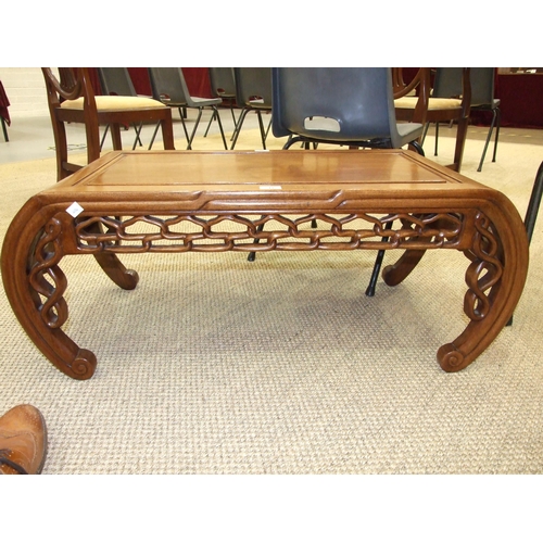 11 - A Chinese low hardwood rectangular-shaped table with decorated carved frieze and curved supports, 10... 