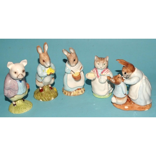 121 - A collection of eleven Beswick Beatrix Potter figures, including 'Peter With Postbag', 'Mrs Flopsy B... 