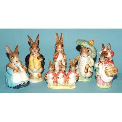 131 - A collection of thirteen Beswick Beatrix Potter figures, including 'Fierce Bad Rabbit', 'Mrs Rabbit ... 