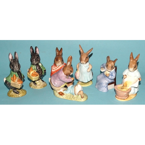 131 - A collection of thirteen Beswick Beatrix Potter figures, including 'Fierce Bad Rabbit', 'Mrs Rabbit ... 