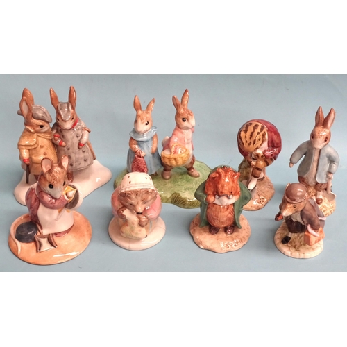 146 - A collection of eleven John Beswick Beatrix Potter figures, including 'Peter and Benjamin Picking Ap... 