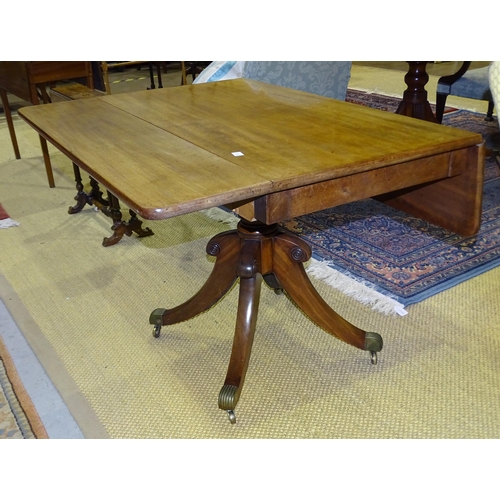 21 - A 19th century mahogany drop leaf rectangular top breakfast table on turned column and four splayed ... 