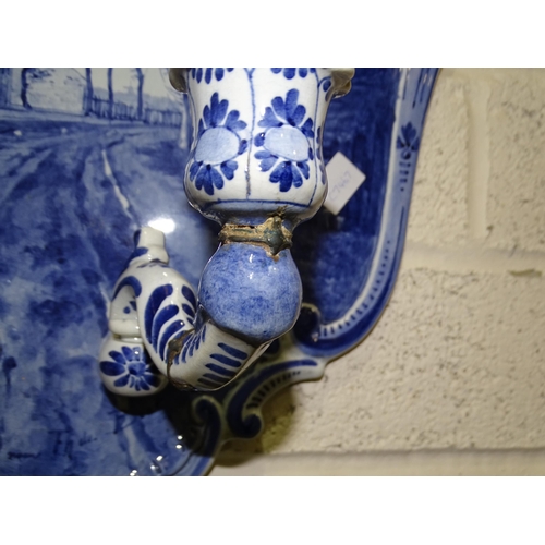 32 - A 20th century Delft ceramic girandole with scenic decoration, signed F H De Boot, 55cm high, (one s... 
