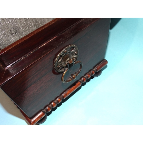39 - A rosewood sarcophagus-shaped tea caddy with two internal lidded compartments and glass mixing bowl ... 