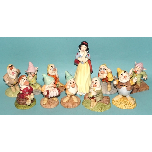 76 - A collection of thirteen Royal Doulton 'Snow White & The Seven Dwarfs' figures: 'Snow White' SW9... 