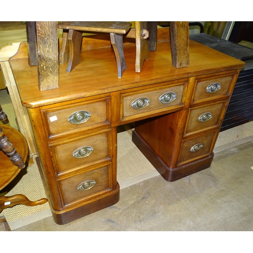 18 - A 19th century walnut kneehole desk fitted with seven drawers, 112cm wide, 77cm high, (converted fro... 