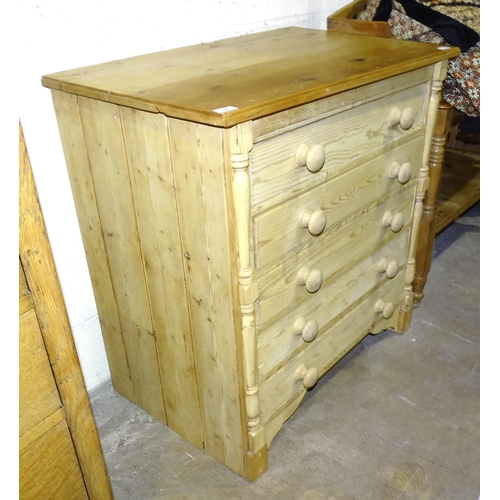 22 - A pine chest of five long drawers, 86cm wide, 90cm high.