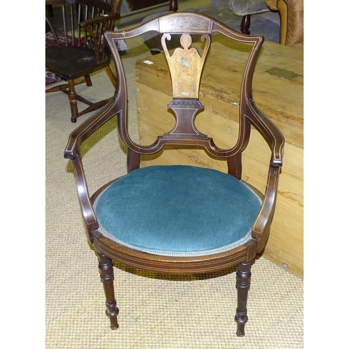 25 - An Edwardian inlaid salon chair with oval seat, on turned legs.