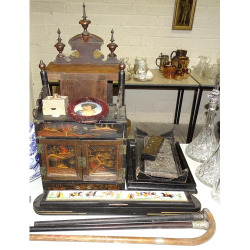41 - A walnut American mantel clock, an ebonised print after Bartolozzi and other items.
